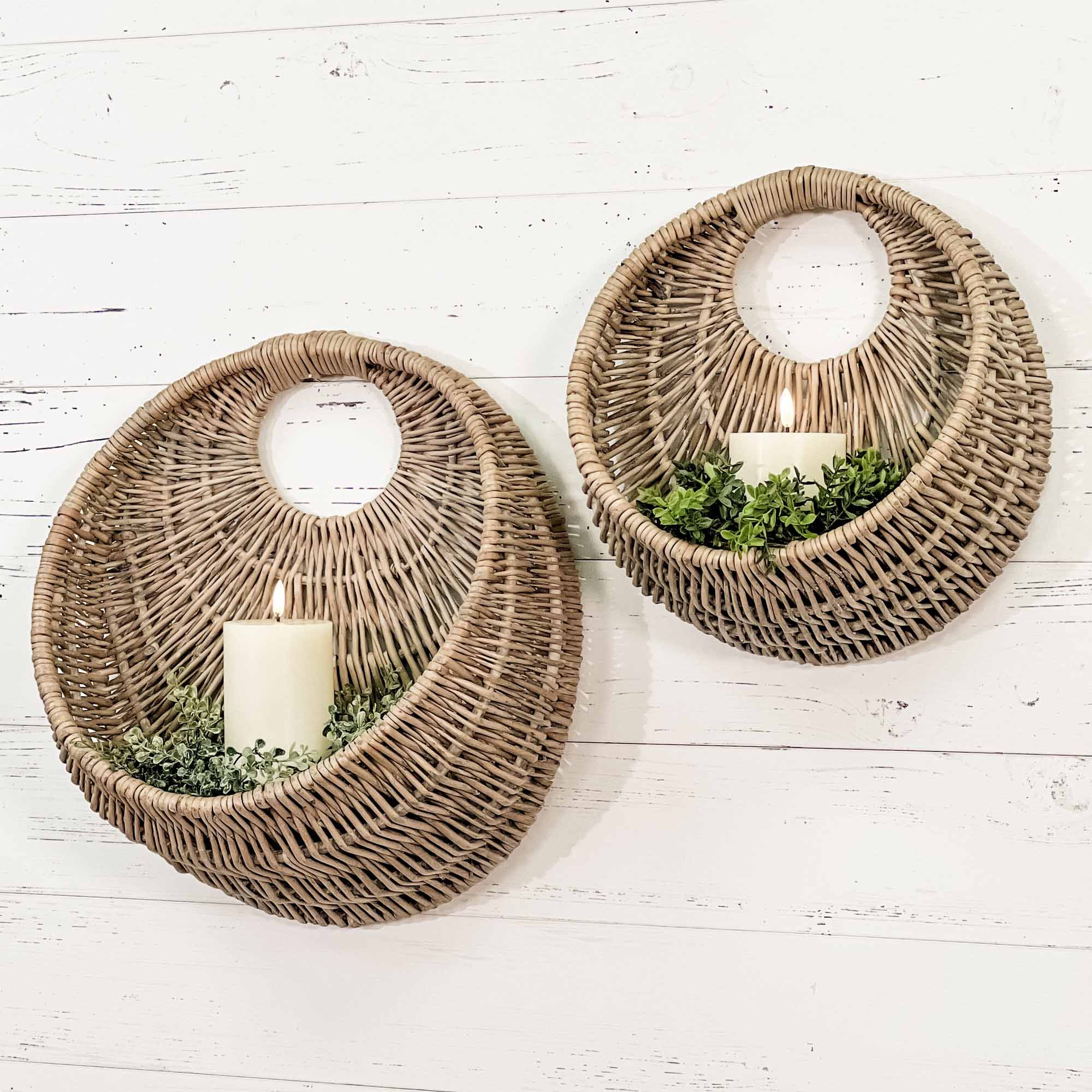 Pair of crescent shaped wall baskets in natural tones