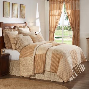 Kaila patchwork bedding in shades of gold, rose, cream and navy